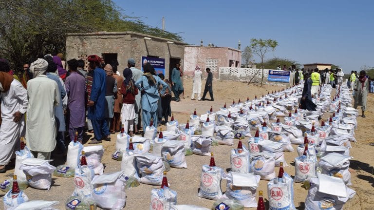Rows of food sacks laid out for a food distribution