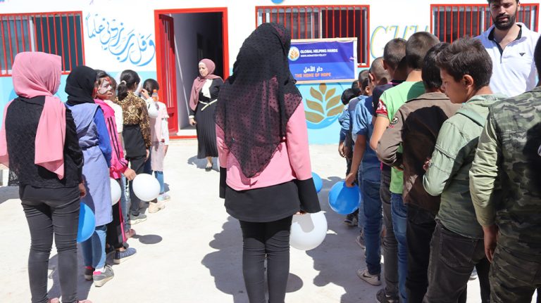 Children queuing outside the Home of Hope centre
