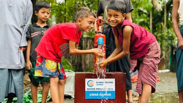 Children drinking from a new Global Helping Hands hand pump in the Rohingya camps