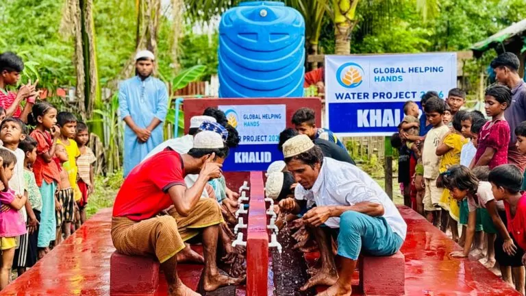 Community at a new Global Helping Hands water well in the Rohingya camps