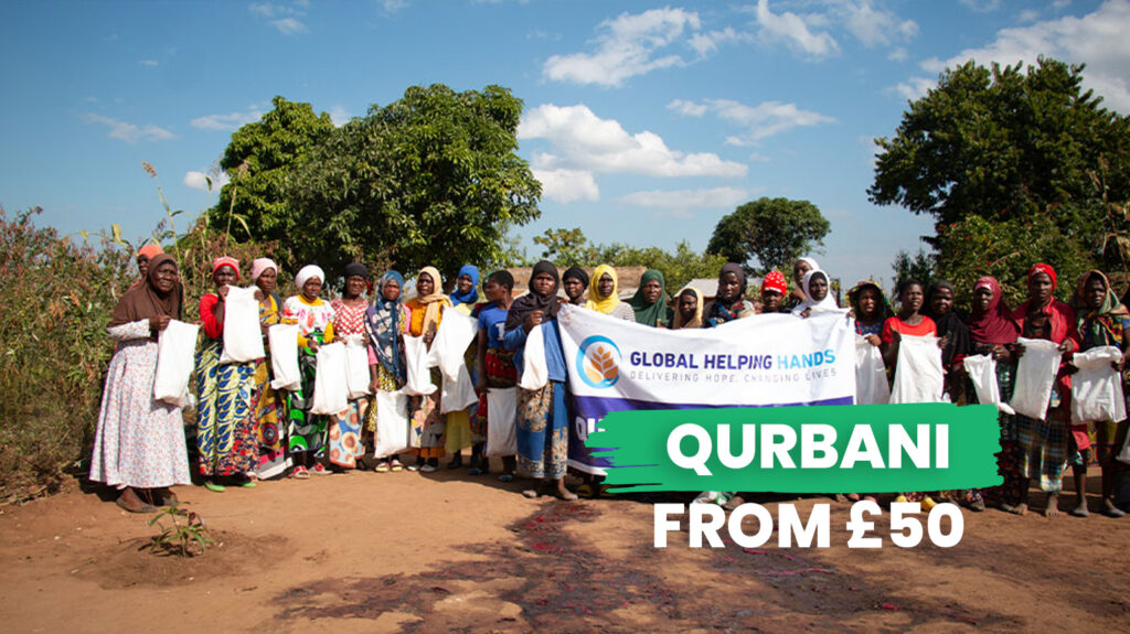 Community members receiving Qurbani assistance in Malawi village setting