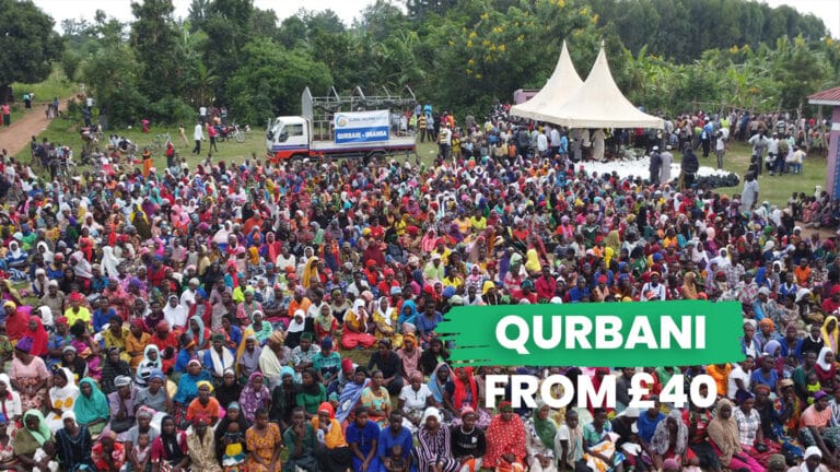 Ugandan families receiving Qurbani meat during charitable distribution event