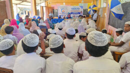 Children collecting school bags and supplies at Sri Lanka education aid event