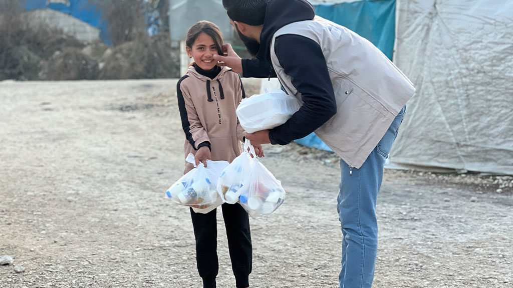 Third image in a numbered sequence showing humanitarian aid or relief work