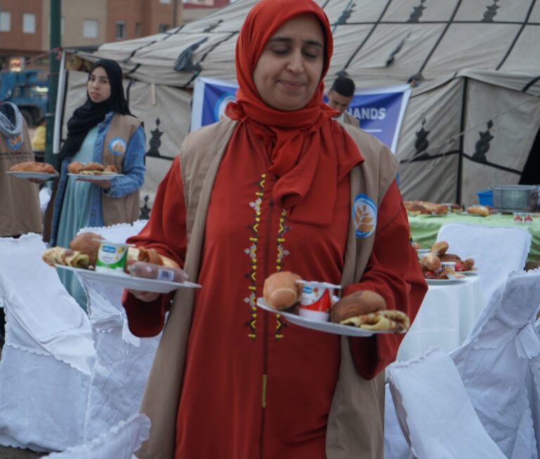 Volunteers serving iftar meals in Morocco