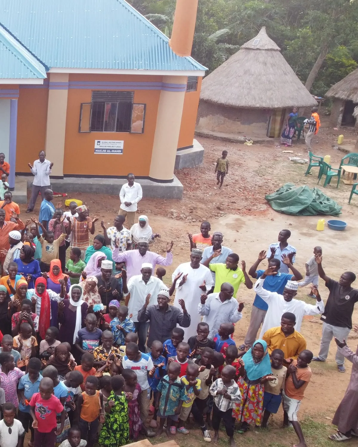 Crowd celebrating outside a new Global Helping Hands masjid in Uganda
