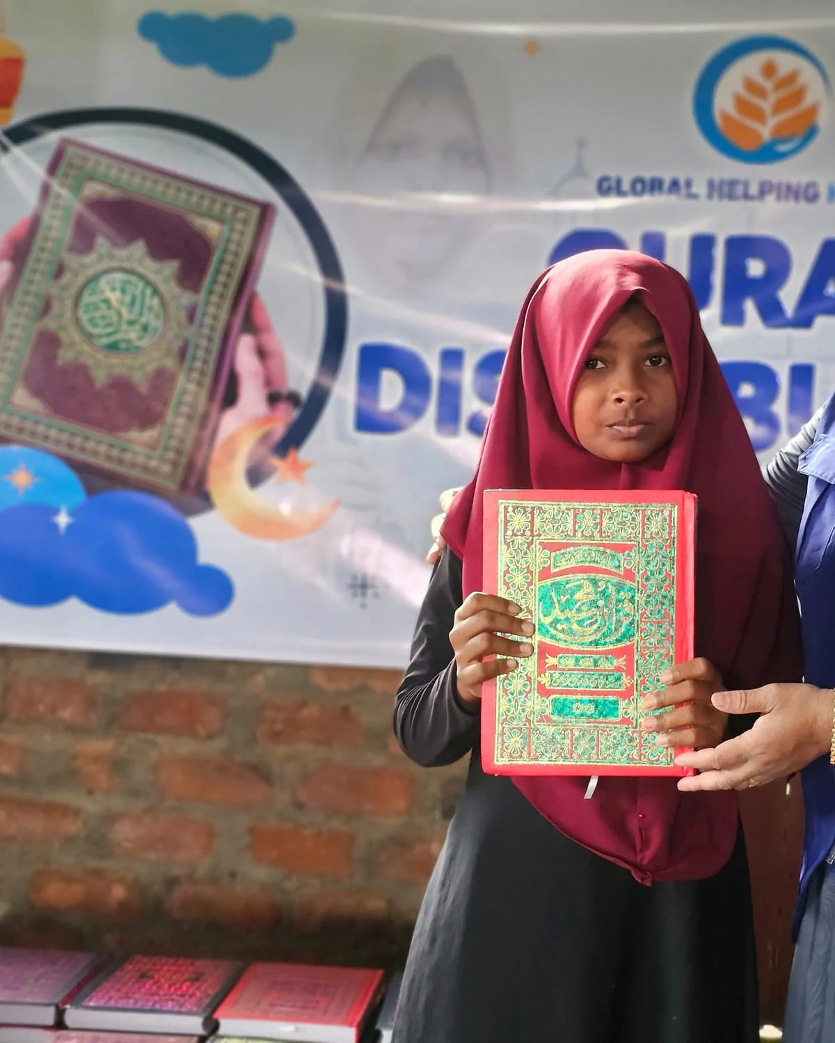Girl holding her own copy of the Quran in Sri Lanka