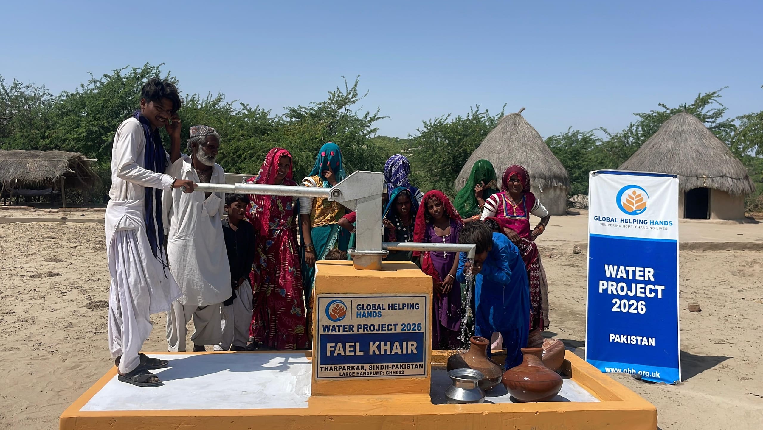 Villagers at a new Global Helping Hands hand pump in Tharparkar, Pakistan