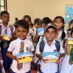 School children holding their hot meals in Sri Lanka